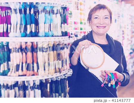 Woman buying embroidery accessories Woman buying embroidery accessories 41143777
