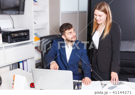 Administrator and seller at workplace in showroom Administrator and seller at workplace in showroom 41144271