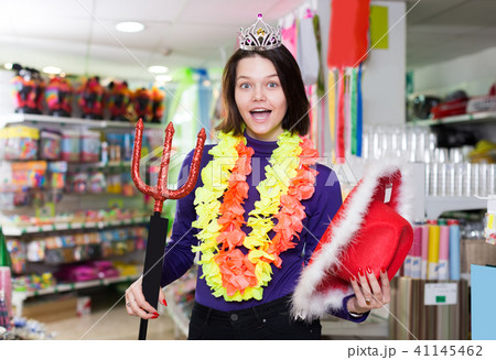 cheerful girl showing festival things in store cheerful girl showing festival things in store 41145462