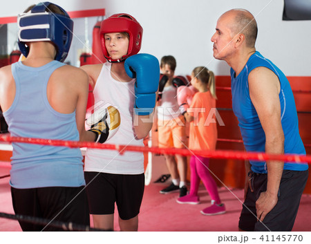 Young boys at boxing training with instructor Young boys at boxing training with instructor 41145770