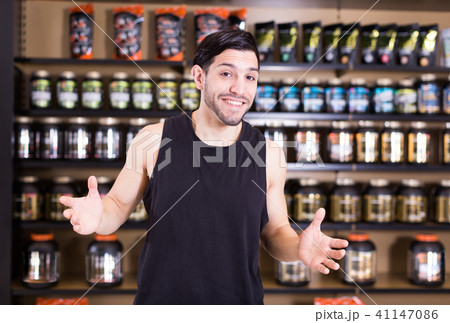 seller welcoming in sport nutrition shop seller welcoming in sport nutrition shop 41147086