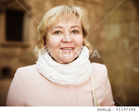 Female in the city in scarf and coat Female in the city in scarf and coat 41147348