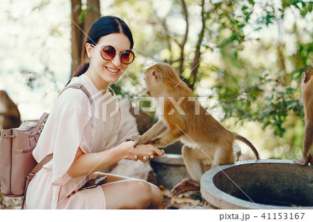 girl playing with monkey 41153167