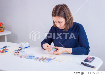 Designer making handmade brooch Designer making handmade brooch 41153933