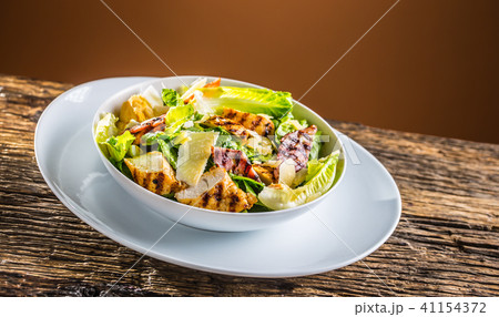 Delicious salad caesar with grilled chicken breast 41154372
