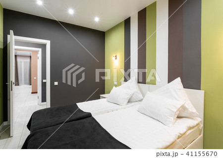 Hotel standart room. modern bedroom with white pillows. simple and stylish interior. interior 41155670