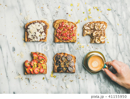 Healthy breakfast with wholegrain toasts , coffee over grey marble background Healthy breakfast with wholegrain toasts , coffee over grey marble background 41155950