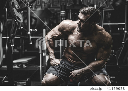 Handsome model young man training back in gym Handsome model young man training back in gym 41159028