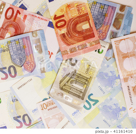 Cash on table isolated: dollars, euro, rubl broken money. All in mess, global crisis concept 41161410