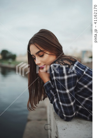beautiful brunette girl on the street beautiful brunette girl on the street 41162170