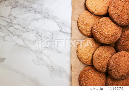 On a marble white table, sandy round cookies, On a marble white table, sandy round cookies, 41162794