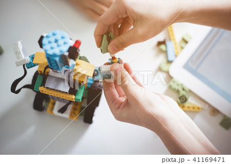 Children hands making modern toy 41169471