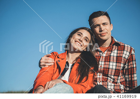 Happy young people hugging in nature  41169919