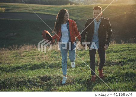 Joyful girl looking at smiling boyfriend in nature Joyful girl looking at smiling boyfriend in nature 41169974