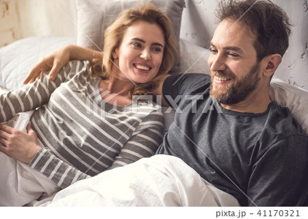 Gentle happy man is tenderly embracing his soulmate 41170321