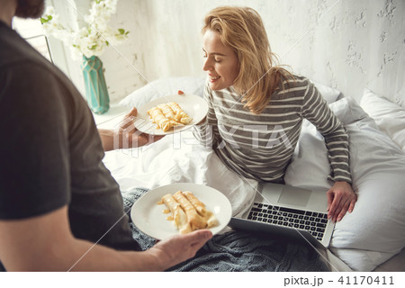 Caring man is giving soulmate tasty breakfast Caring man is giving soulmate tasty breakfast 41170411