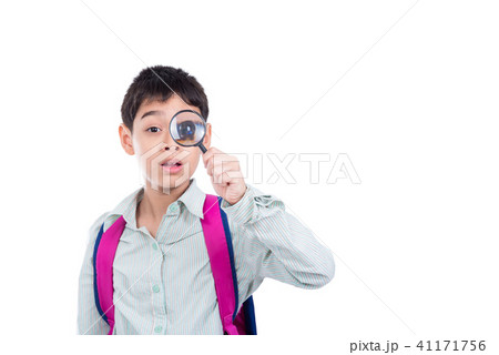 boy looking thru magnifying glass over white boy looking thru magnifying glass over white 41171756