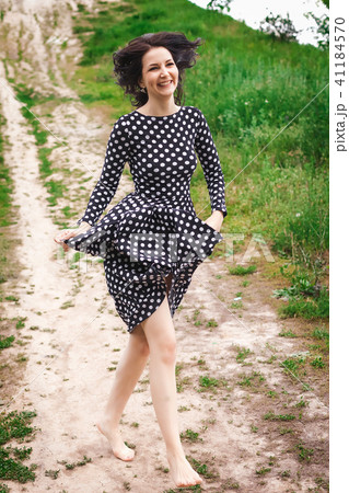 girl walking down along the path 41184570