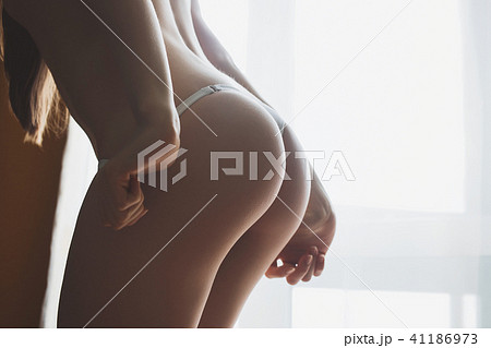 Female butt, white background Female butt, white background 41186973
