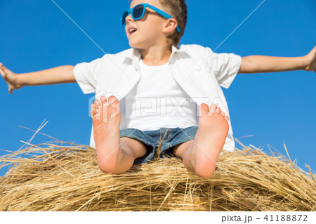 Happy little boy playing in the park at the day time. 41188872