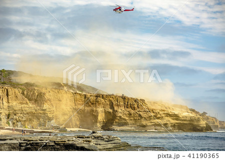 US coastguard helicopter in flight with clouds US coastguard helicopter in flight with clouds 41190365