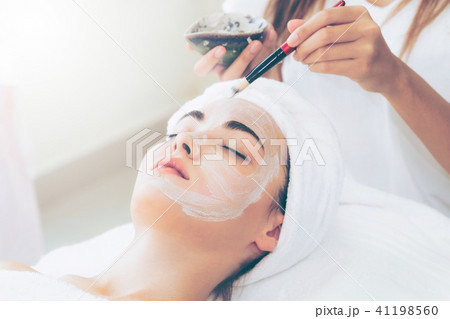 Beautiful woman having a facial treatment at spa. 41198560
