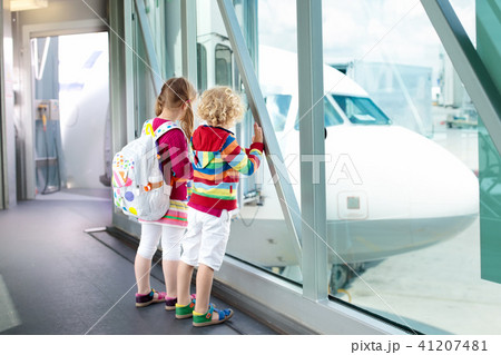 Kids travel and fly. Child at airplane in airport Kids travel and fly. Child at airplane in airport 41207481