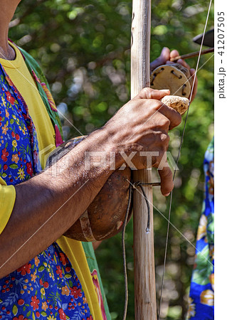 Berimbau player playing his instrument Berimbau player playing his instrument 41207505