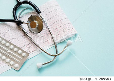 Cardiogram and stethoscope on blue 41209503