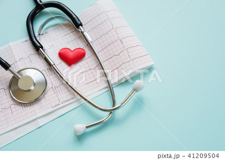Cardiogram and stethoscope on blue 41209504
