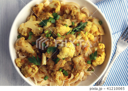 Cauliflower stew with curry. Vegetarian cuisine. Cauliflower stew with curry. Vegetarian cuisine. 41210065