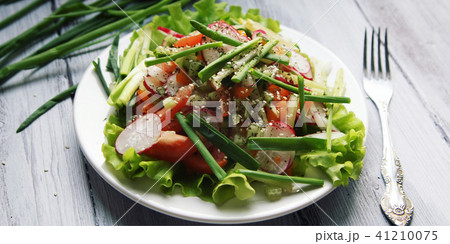 Spring Vegetable Salad on the white plate. Vegan. 41210075