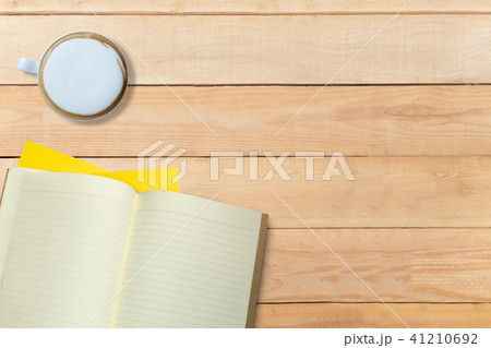Empty book and hot coffee on wooden desk, copy space, mock up Empty book and hot coffee on wooden desk, copy space, mock up 41210692