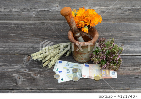 ancient mortar and herbs with euro money banknote ancient mortar and herbs with euro money banknote 41217407