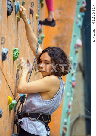 girl climbing up the wall 41225317