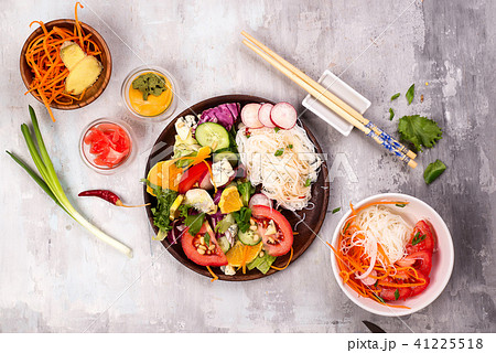 Spicy glass noodles with vegetables - carrots, cucumber, peppers, garlic. Spicy glass noodles with vegetables - carrots, cucumber, peppers, garlic. 41225518