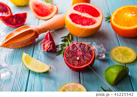 Pattern of slice citrus on blue wooden background Pattern of slice citrus on blue wooden background 41225542