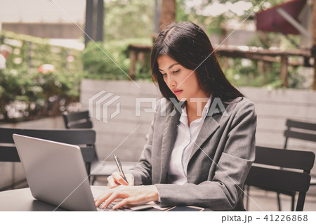 Business Concept.Young Asian businesswoman is working happily.Yo Business Concept.Young Asian businesswoman is working happily.Yo 41226868