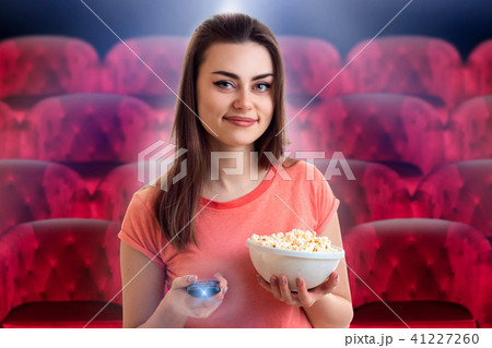 girl watching movie with pop-corn at the cinema 41227260