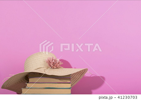 Colorful summer female fashion flat lay. Pink background, old book. 41230703
