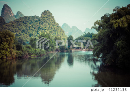 Scenic view of Yulong River among green woods Scenic view of Yulong River among green woods 41235158