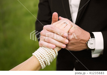Happy brides hold hands 41235683