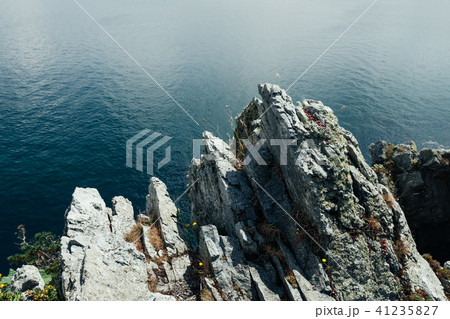 Sharp cliffs hang over the ocean, Sharp cliffs hang over the ocean, 41235827