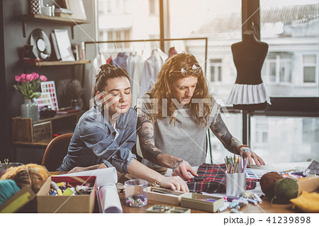 Orderly workers sewing modern clothes 41239898