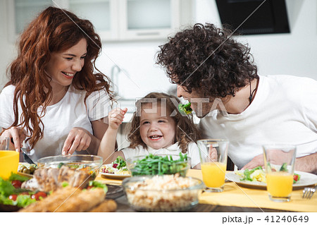 Friendly family having funny lunch together at home  41240649