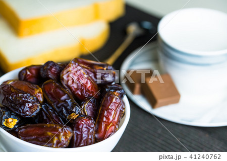 fresh dry dates fruit in small white bowl 41240762