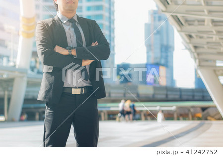 businessman stands in city. businessman stands in city. 41242752
