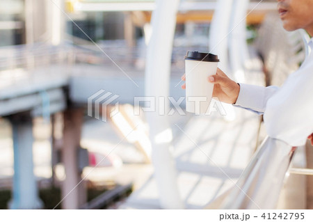Man holding coffee cup. 41242795