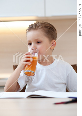 Little boy drinking fresh orange juice Little boy drinking fresh orange juice 41243314