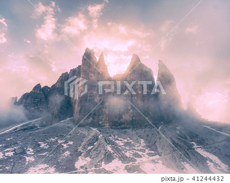 Early misty May evening bellow peaks of  Tre Cime 41244432